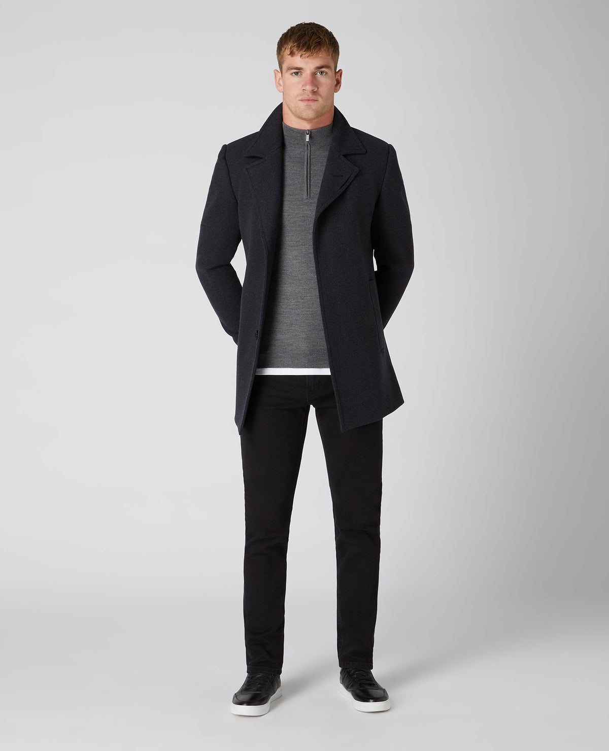 Man wearing a grey Tapered Fit Merino Wool-Blend Half Zip Sweater