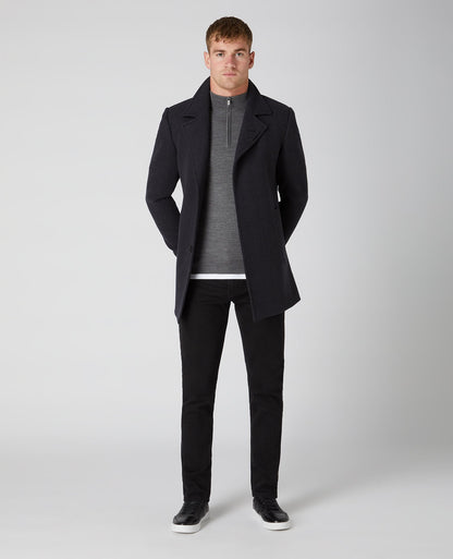 Man wearing a grey Tapered Fit Merino Wool-Blend Half Zip Sweater