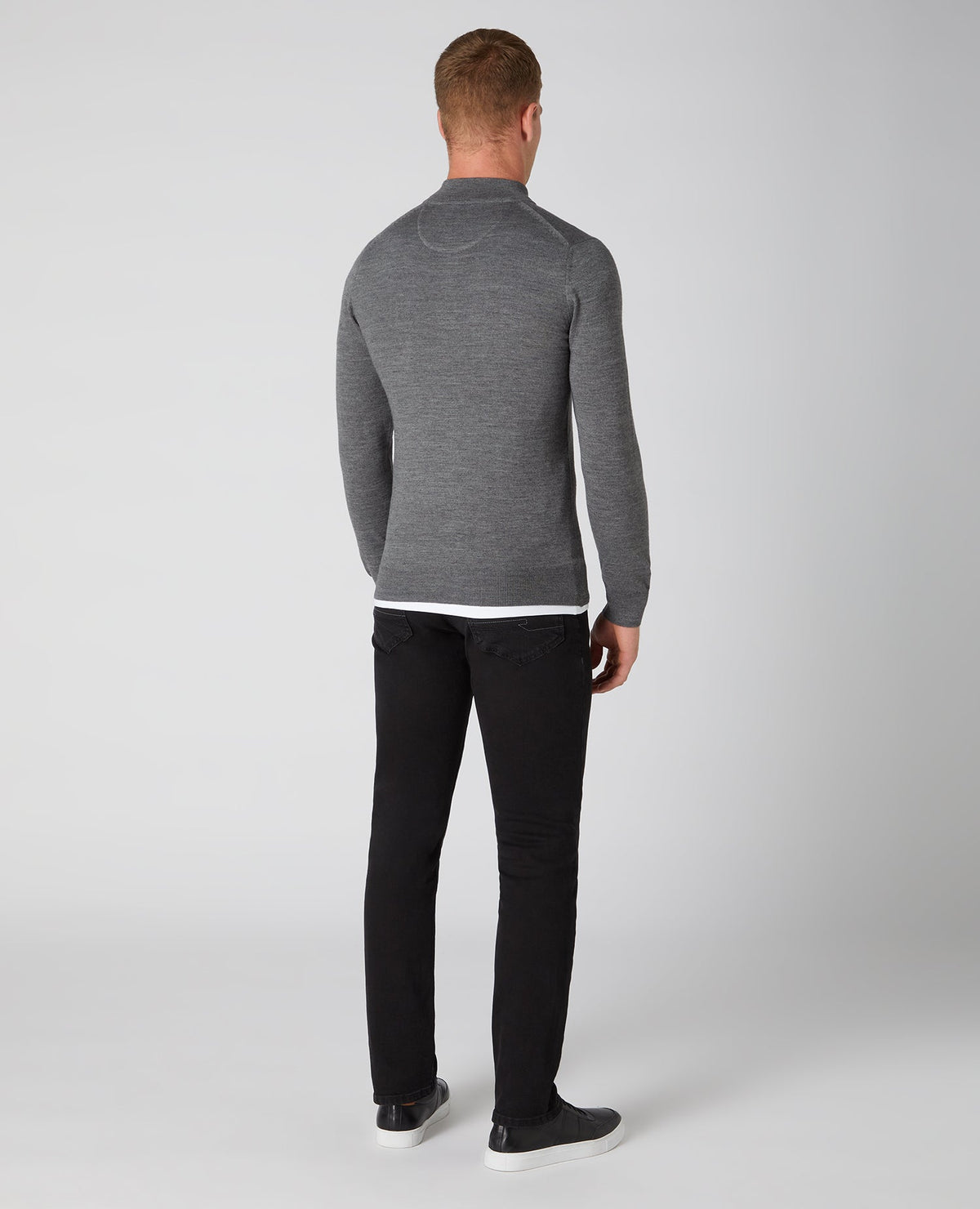 Man wearing a grey Tapered Fit Merino Wool-Blend Half Zip Sweater