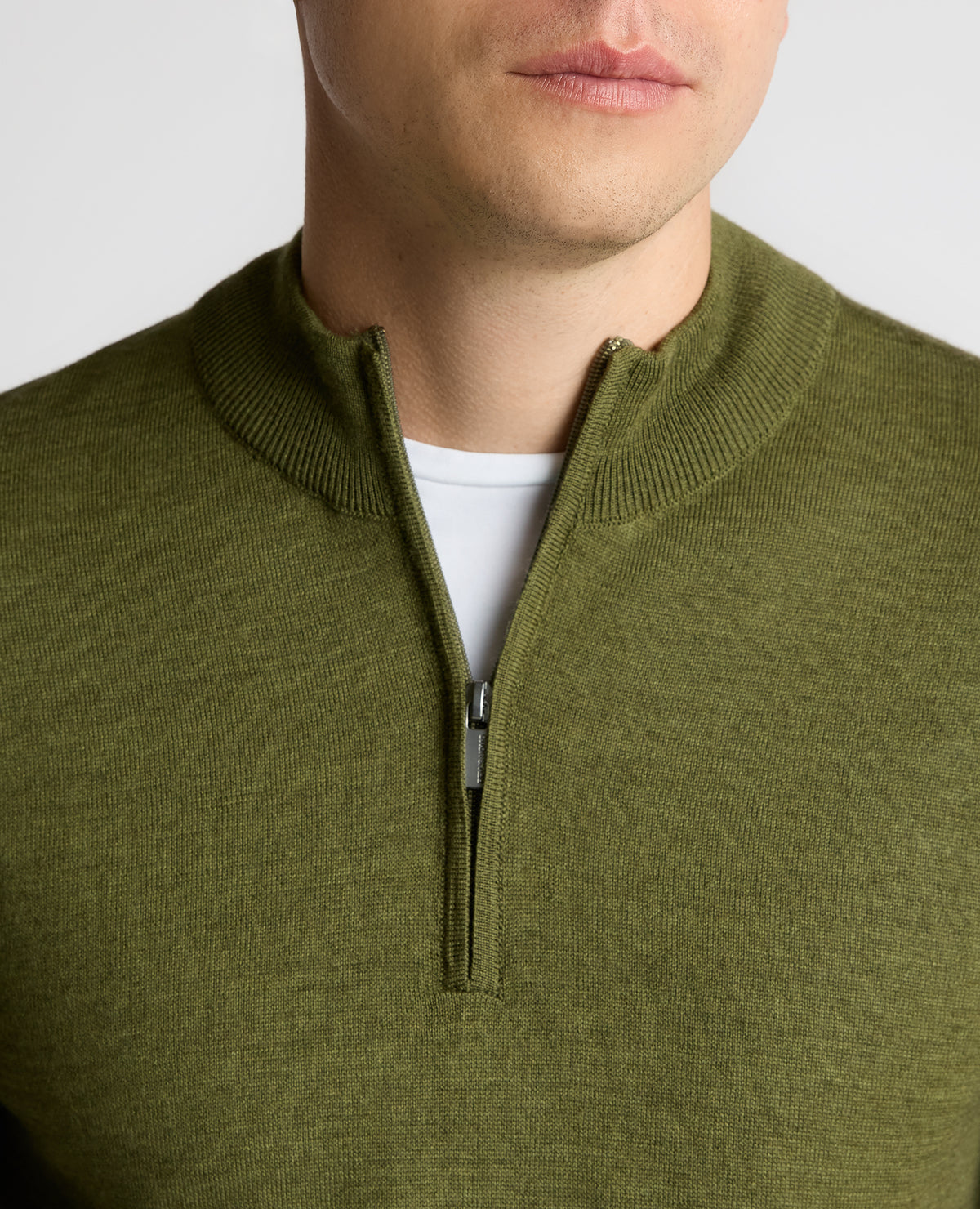 Man wearing a green Half Zip Merino Wool-Blend Sweater