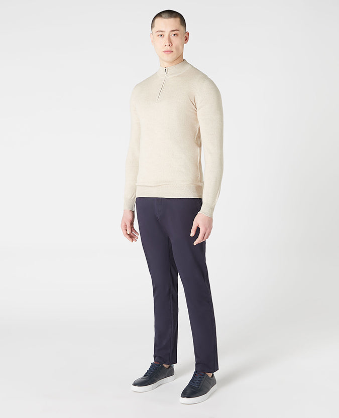 Man wearing a sand Tapered Fit Merino Wool Half Zip Sweater