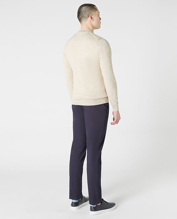 Man wearing a sand Tapered Fit Merino Wool Half Zip Sweater