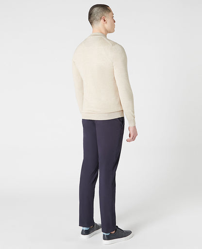 Man wearing a sand Tapered Fit Merino Wool Half Zip Sweater