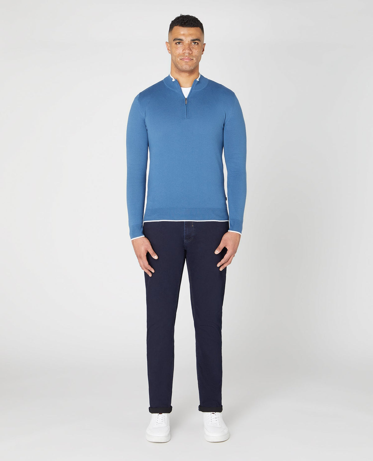 Man wearing a blue Slim Fit Knitted Cotton Half Zip Sweater