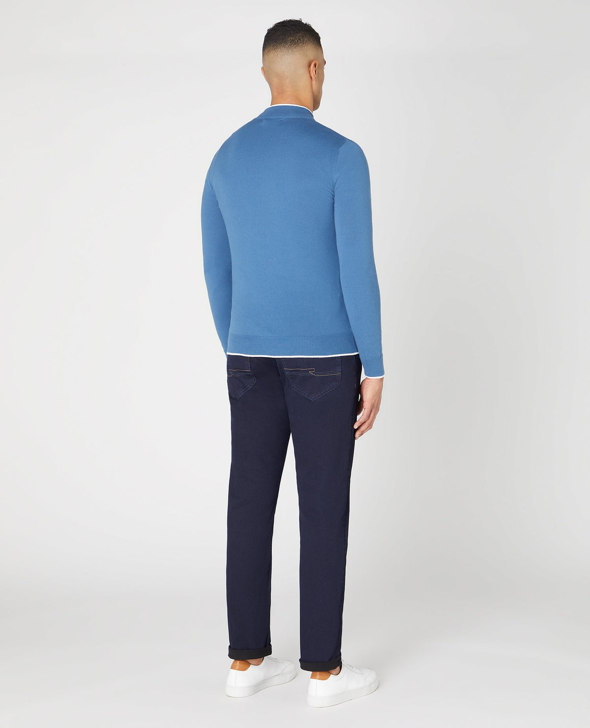 Man wearing a blue Slim Fit Knitted Cotton Half Zip Sweater