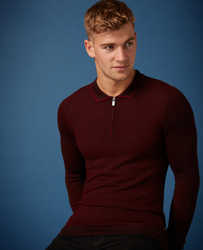 Man wearing a red Slim Fit Merino Wool-Blend Long Sleeve Polo Shirt