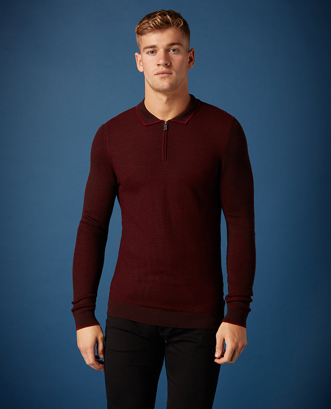 Man wearing a red Slim Fit Merino Wool-Blend Long Sleeve Polo Shirt
