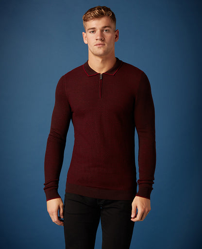 Man wearing a red Slim Fit Merino Wool-Blend Long Sleeve Polo Shirt