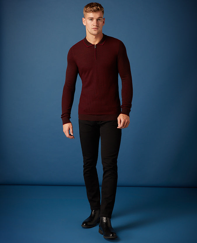 Man wearing a red Slim Fit Merino Wool-Blend Long Sleeve Polo Shirt