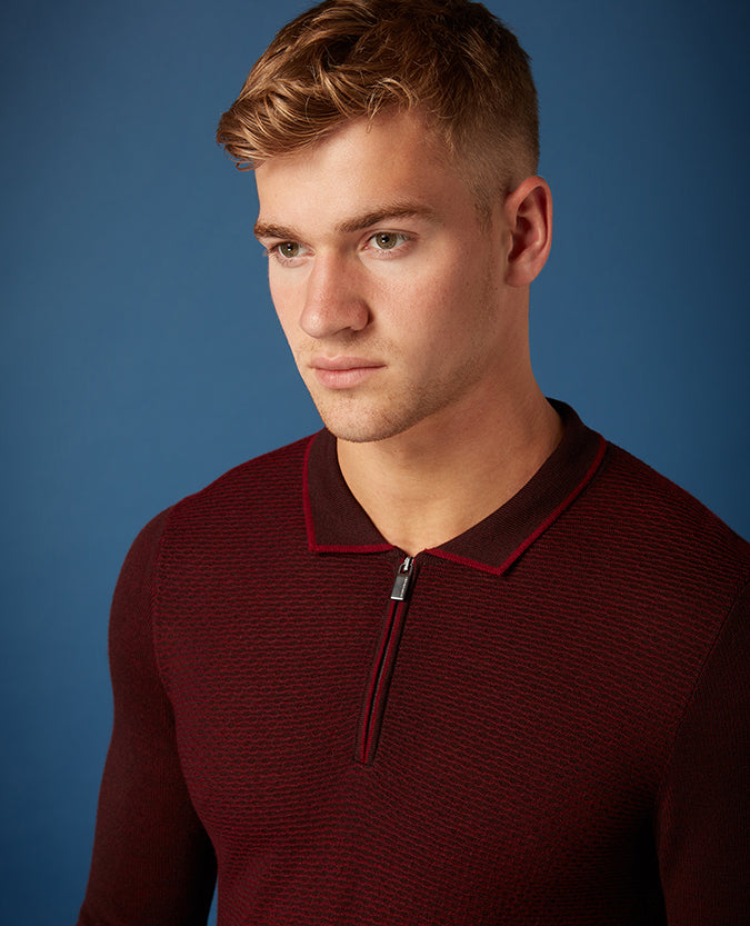 Man wearing a red Slim Fit Merino Wool-Blend Long Sleeve Polo Shirt