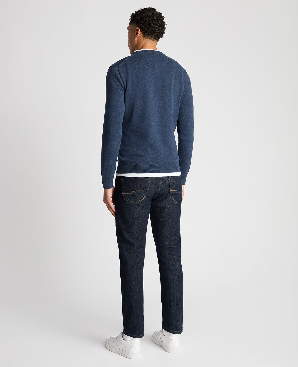 Man wearing a blue Tapered Fit Cotton Crew Neck Sweater