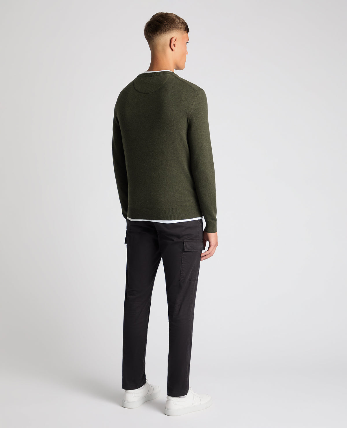 Man wearing a green Tapered Fit Cotton Crew Neck Sweater