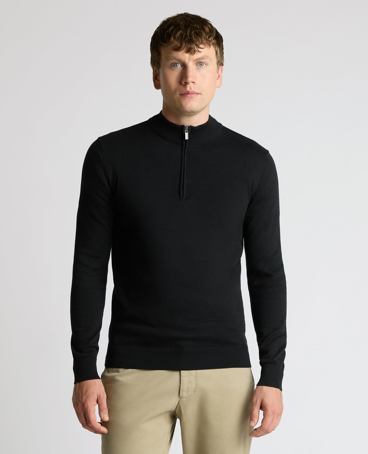Man wearing a black Half Zip Cotton Sweater
