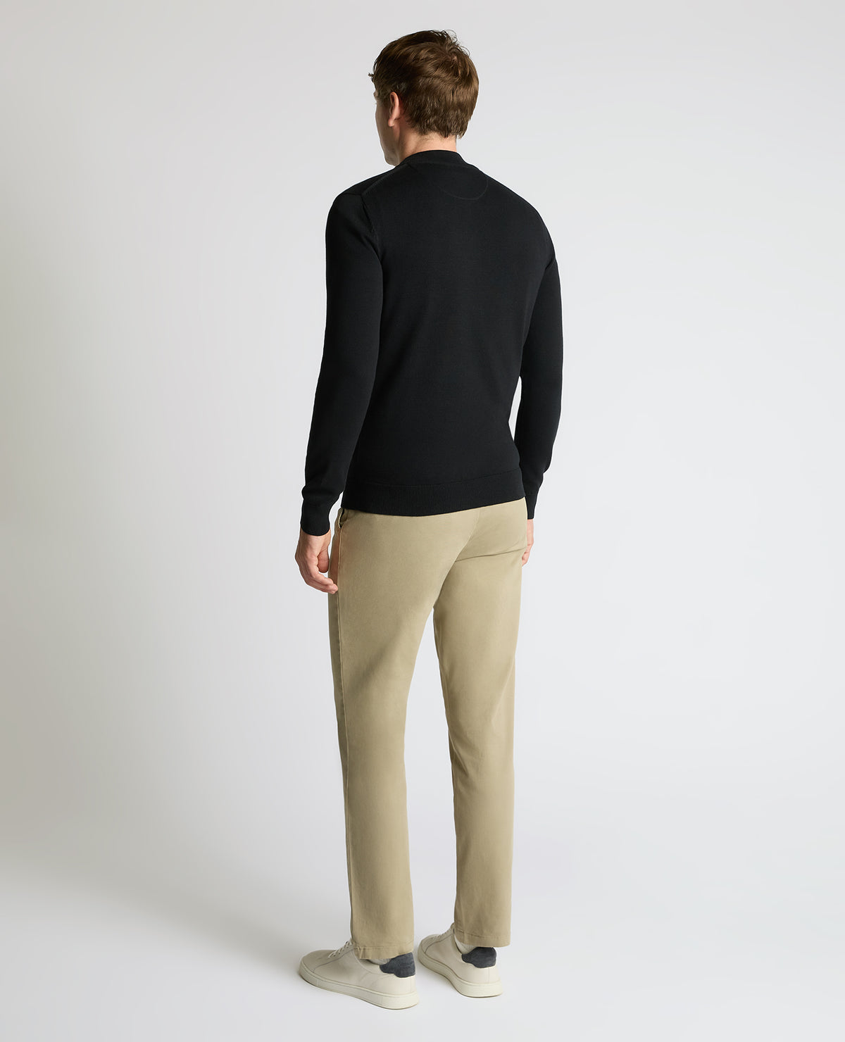 Man wearing a black Half Zip Cotton Sweater