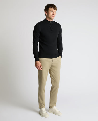 Man wearing a black Half Zip Cotton Sweater
