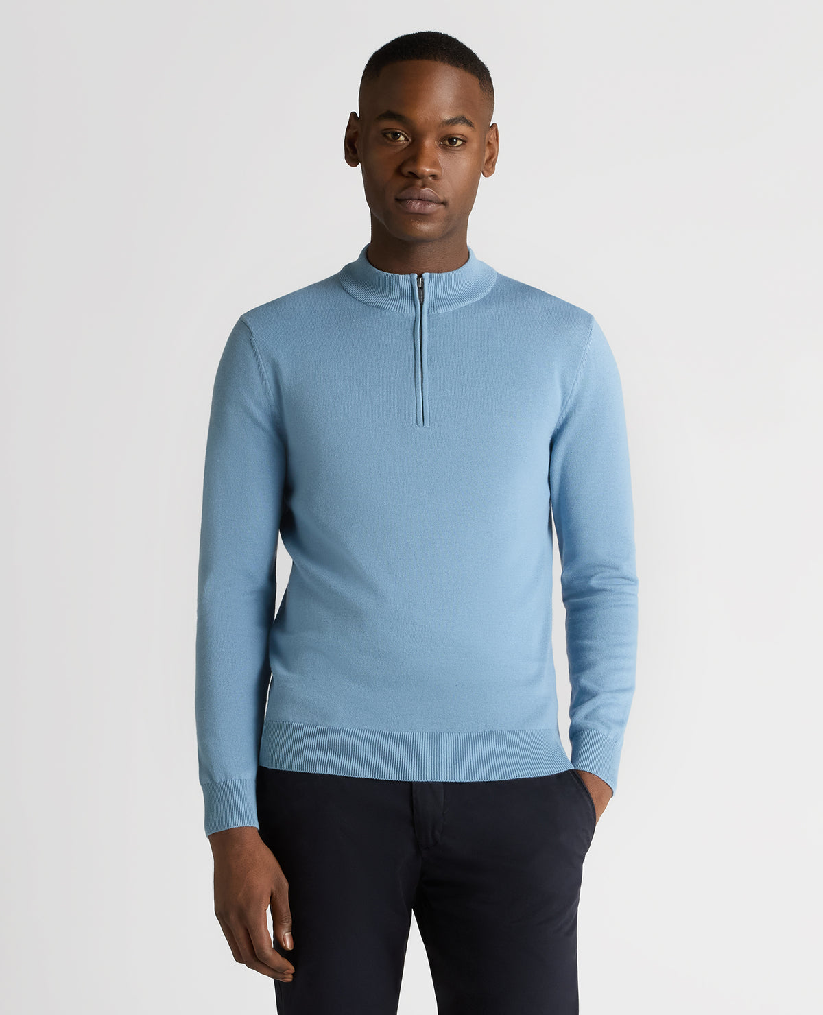 Man wearing a blue Tapered Fit Half Zip Cotton Sweater