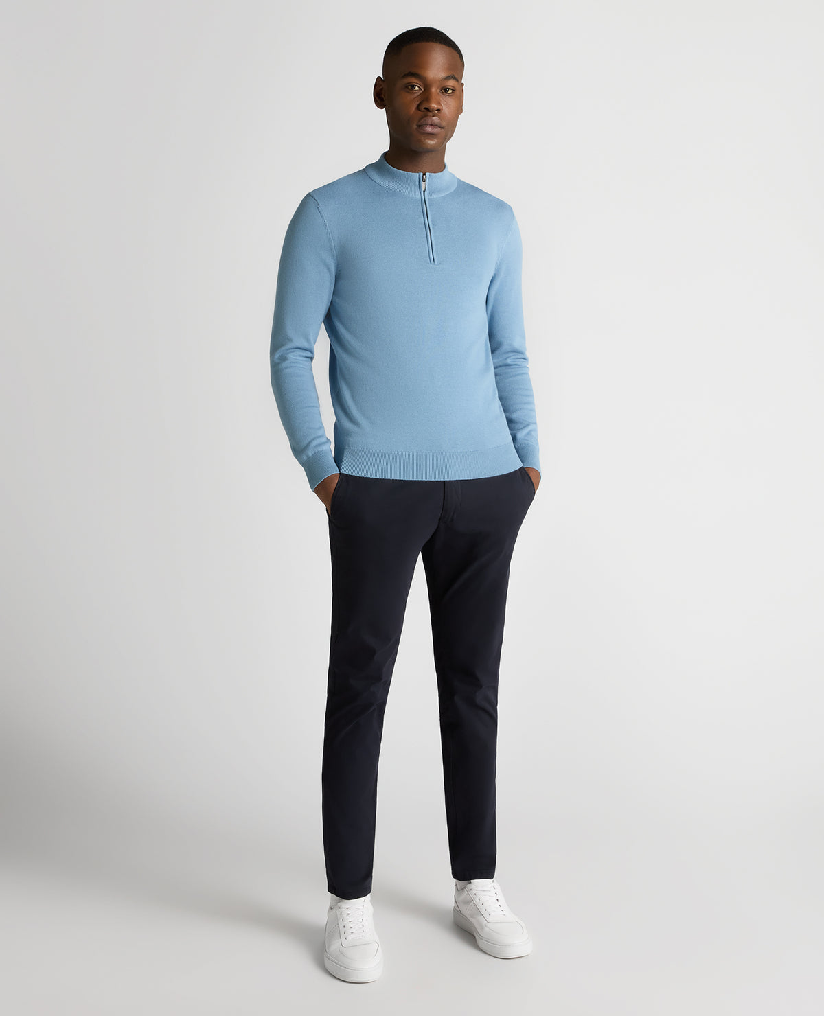 Man wearing a blue Tapered Fit Half Zip Cotton Sweater
