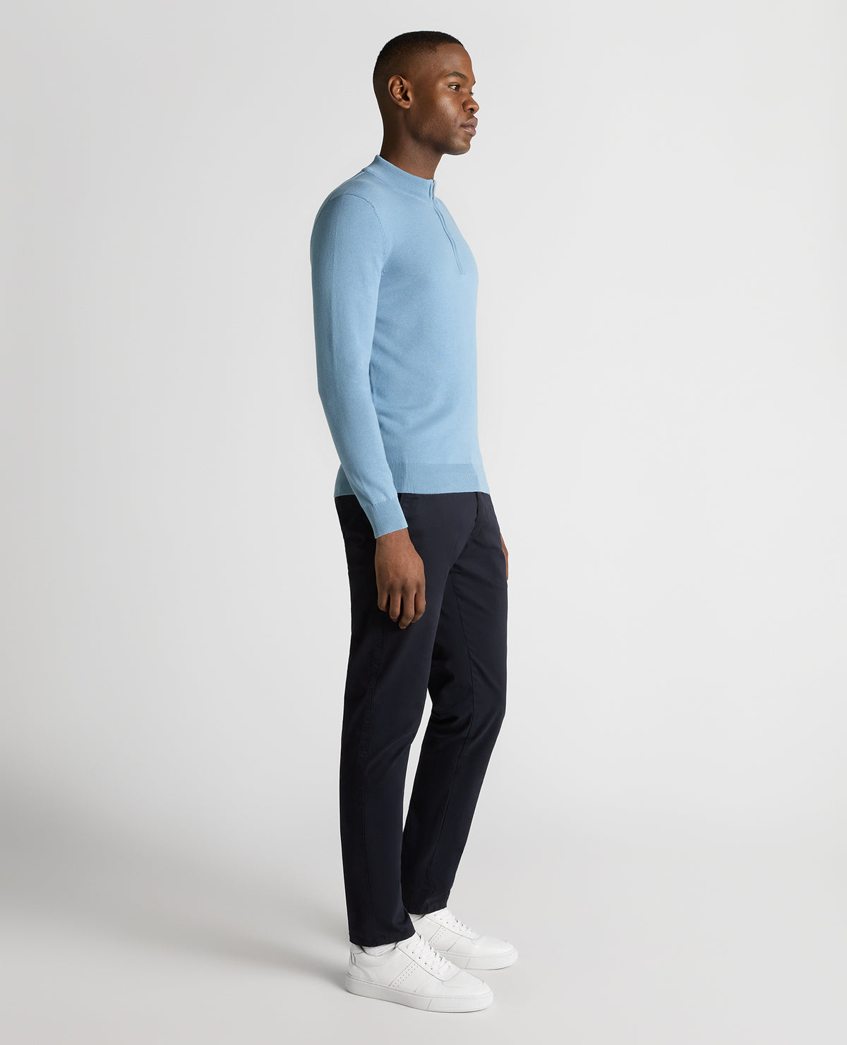 Man wearing a blue Tapered Fit Half Zip Cotton Sweater