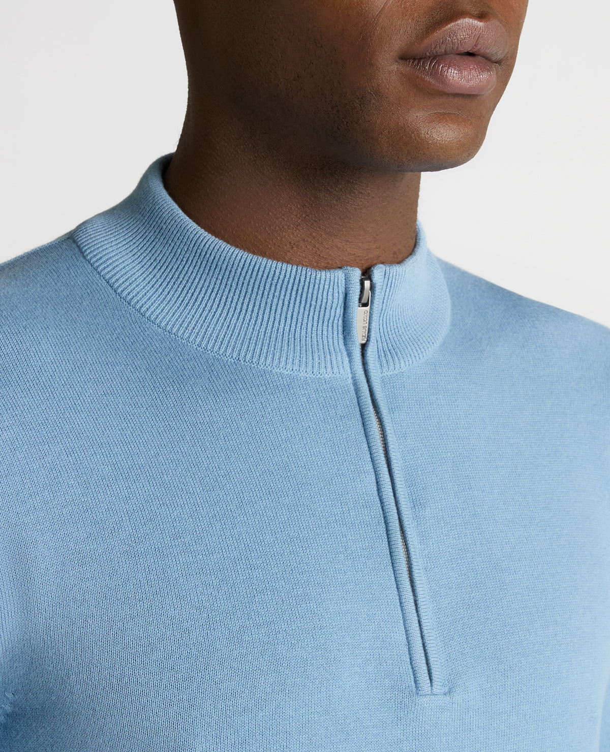Man wearing a blue Tapered Fit Half Zip Cotton Sweater