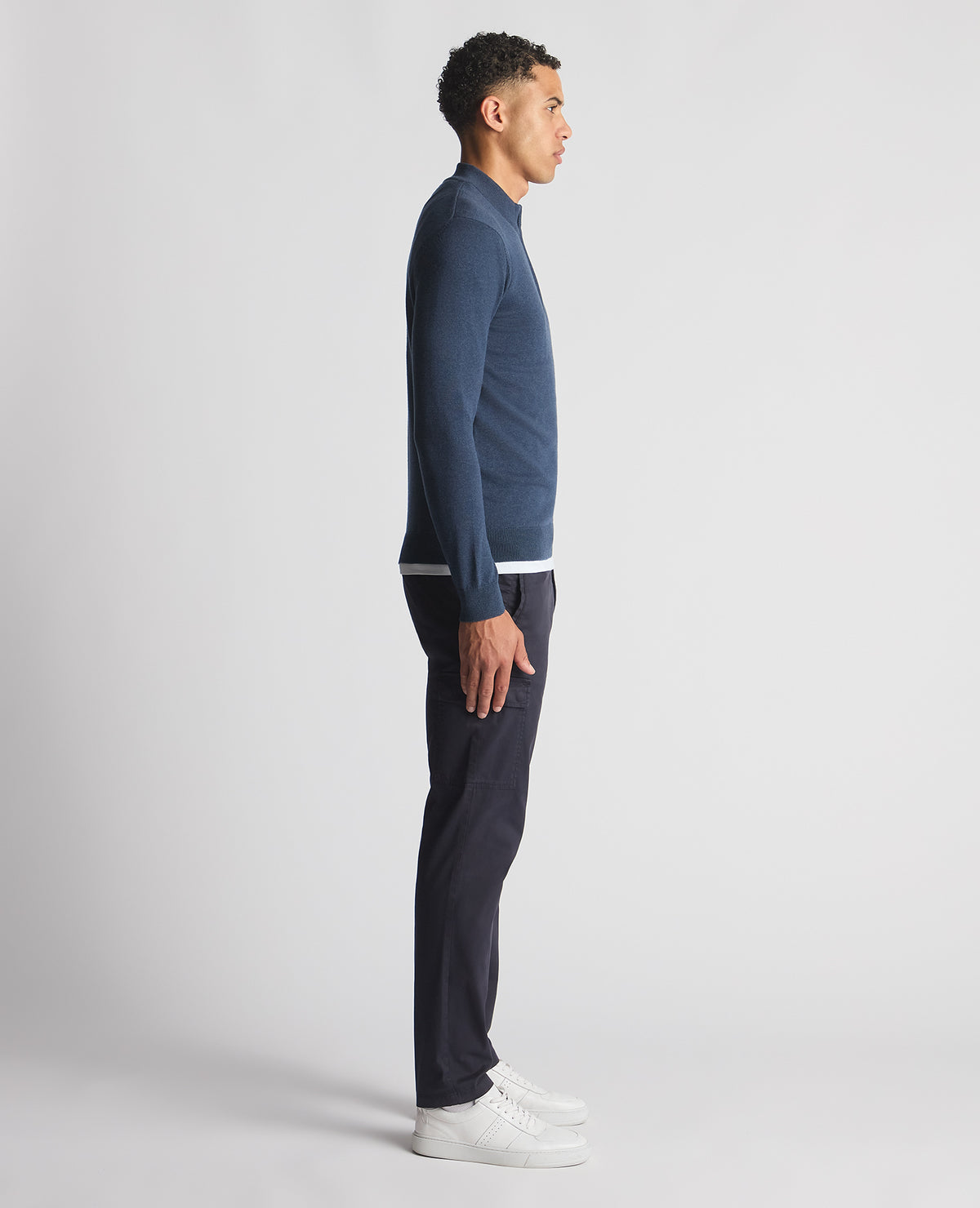 Man wearing a blue Tapered Fit Half Zip Cotton Sweater
