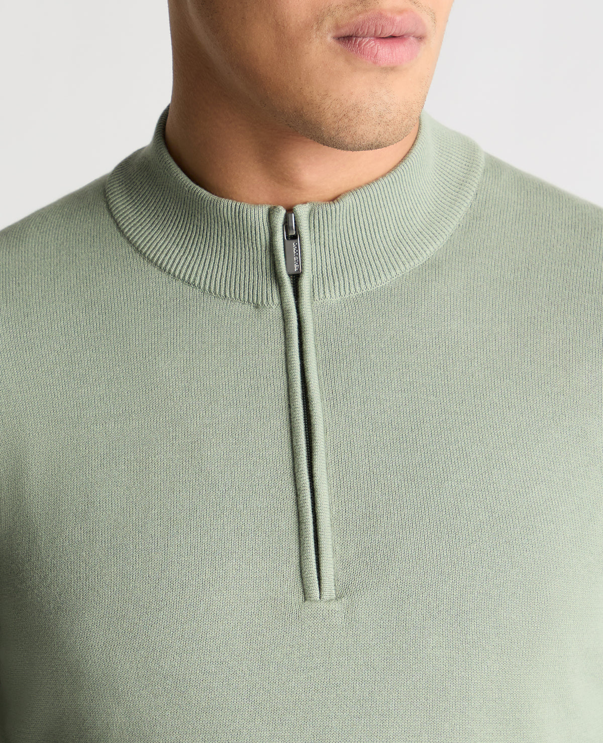 Man wearing a green jumper
