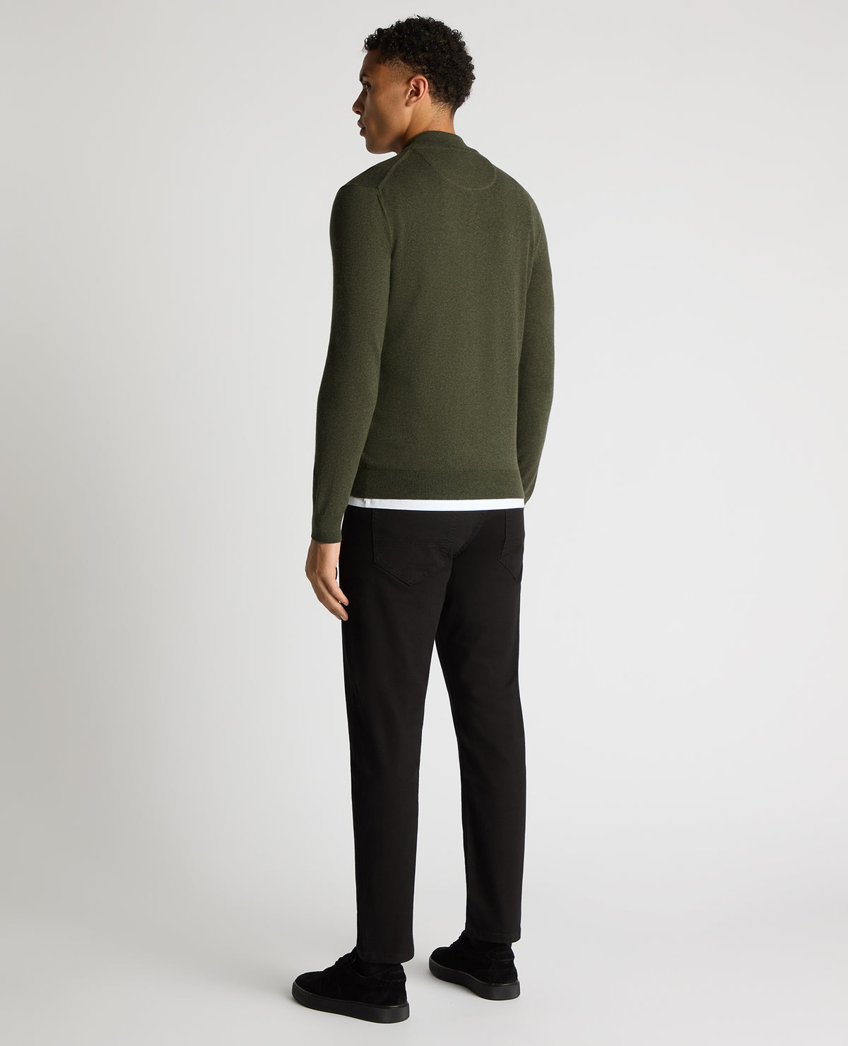 Man wearing a green Tapered Fit Half Zip Cotton Sweater