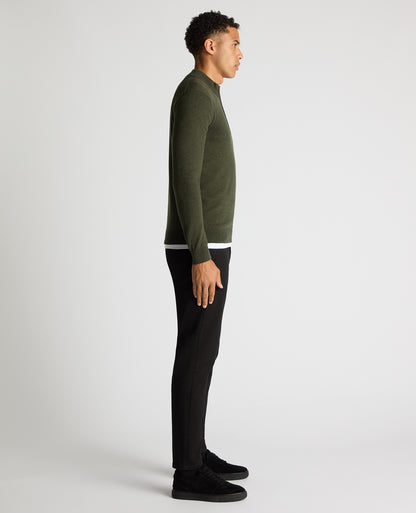 Man wearing a green Tapered Fit Half Zip Cotton Sweater
