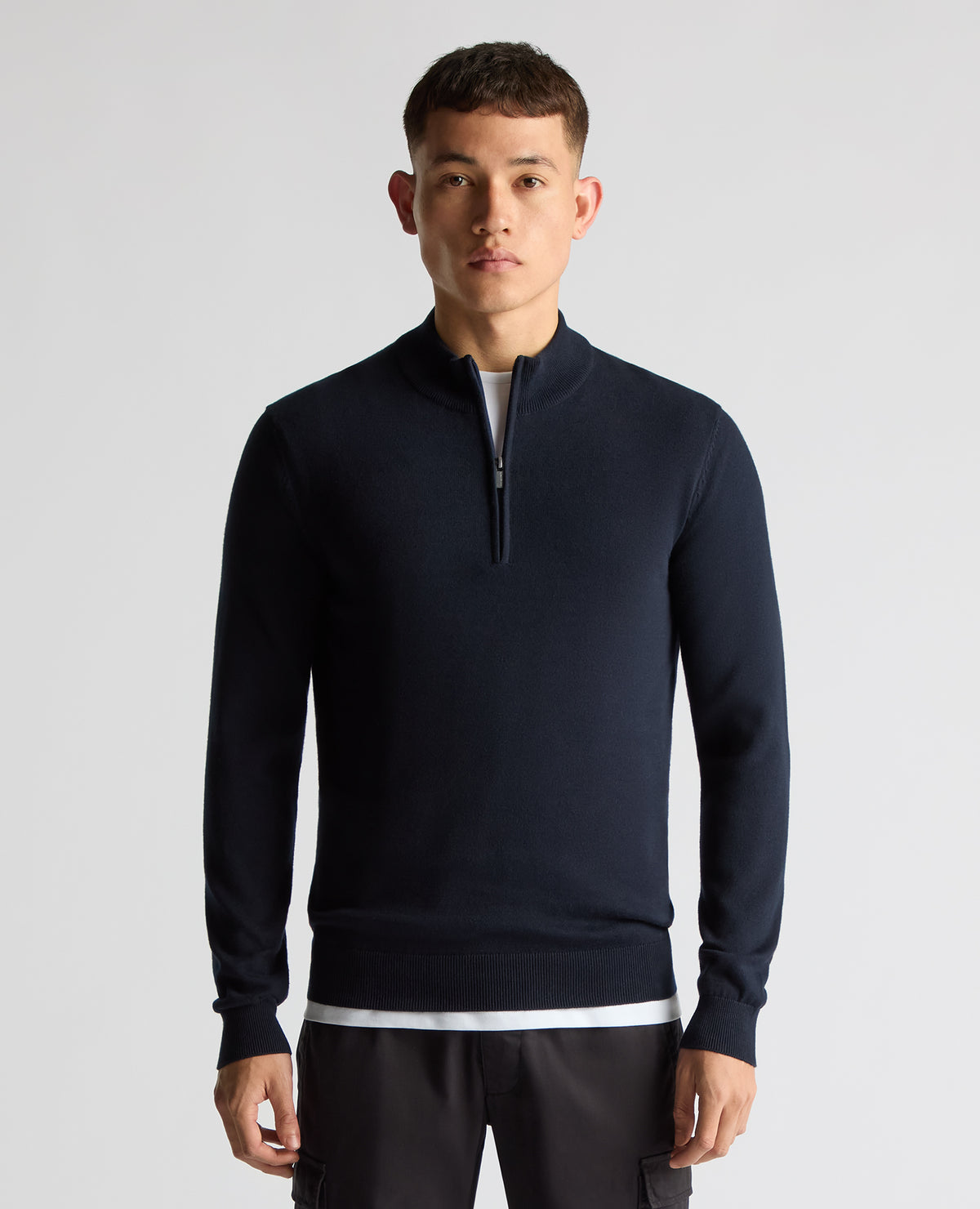 Man wearing a navy Tapered Fit Half Zip Cotton Sweater