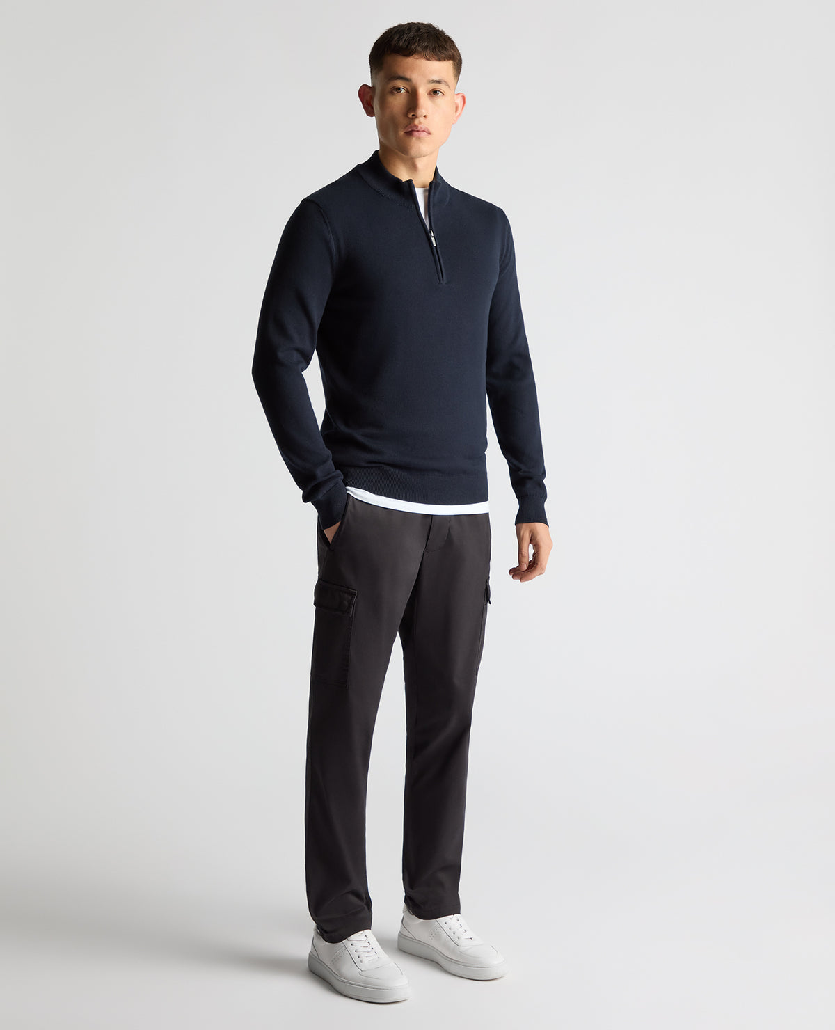 Man wearing a navy Tapered Fit Half Zip Cotton Sweater