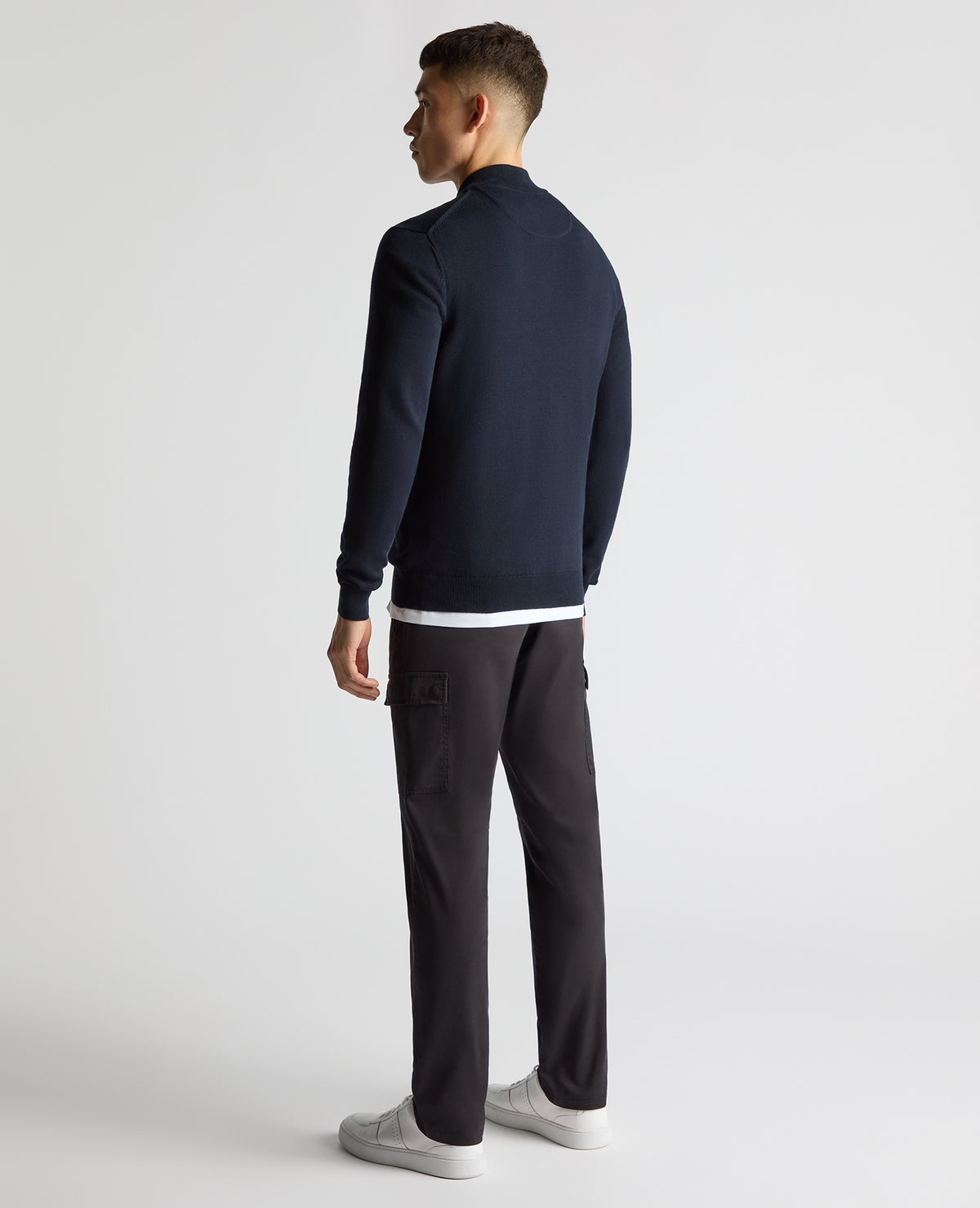 Man wearing a navy Tapered Fit Half Zip Cotton Sweater