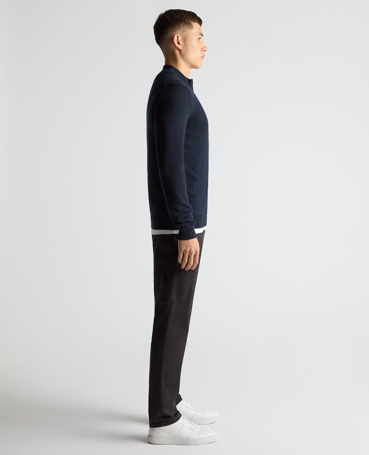 Man wearing a navy Tapered Fit Half Zip Cotton Sweater