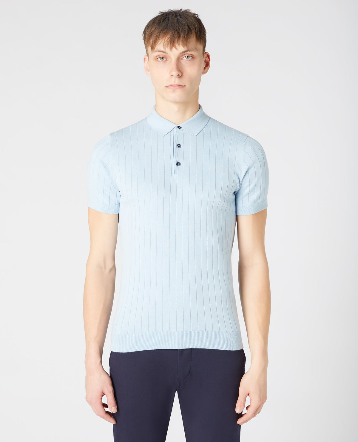 Man wearing a blue Slim Fit Knitted Cotton Short-Sleeve Polo Shirt