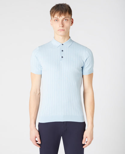 Man wearing a blue Slim Fit Knitted Cotton Short-Sleeve Polo Shirt