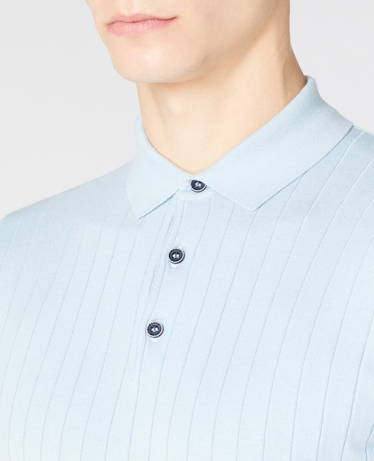 Man wearing a blue Slim Fit Knitted Cotton Short-Sleeve Polo Shirt