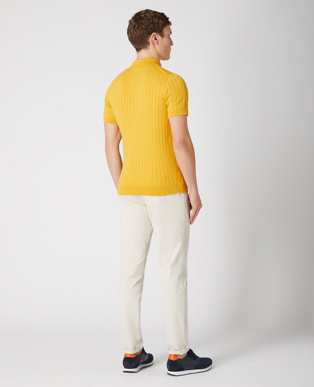 Man wearing a orange Slim Fit Knitted Cotton Short-Sleeve Polo Shirt