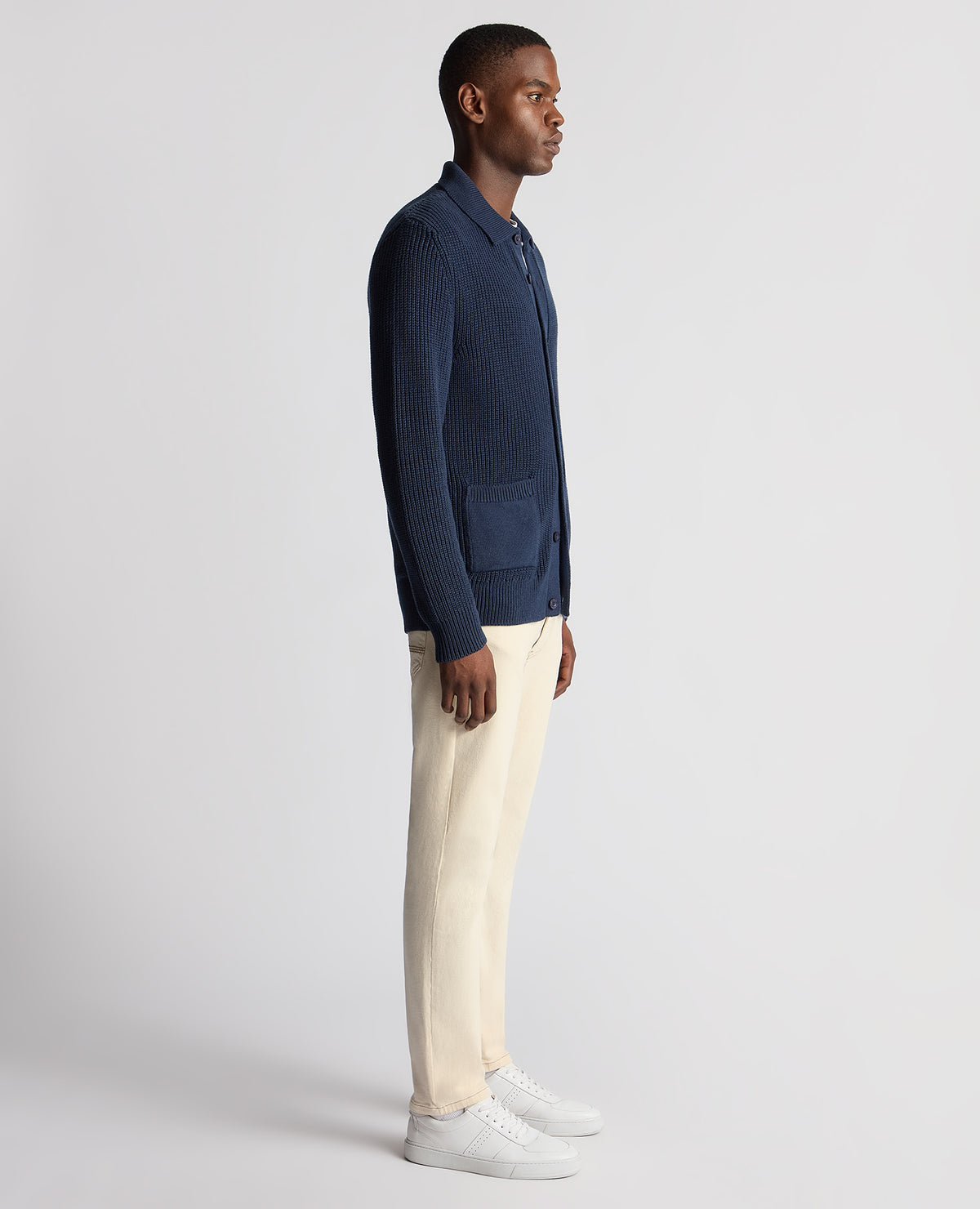 Man wearing a blue Tapered Fit Chunky Knit Cardigan