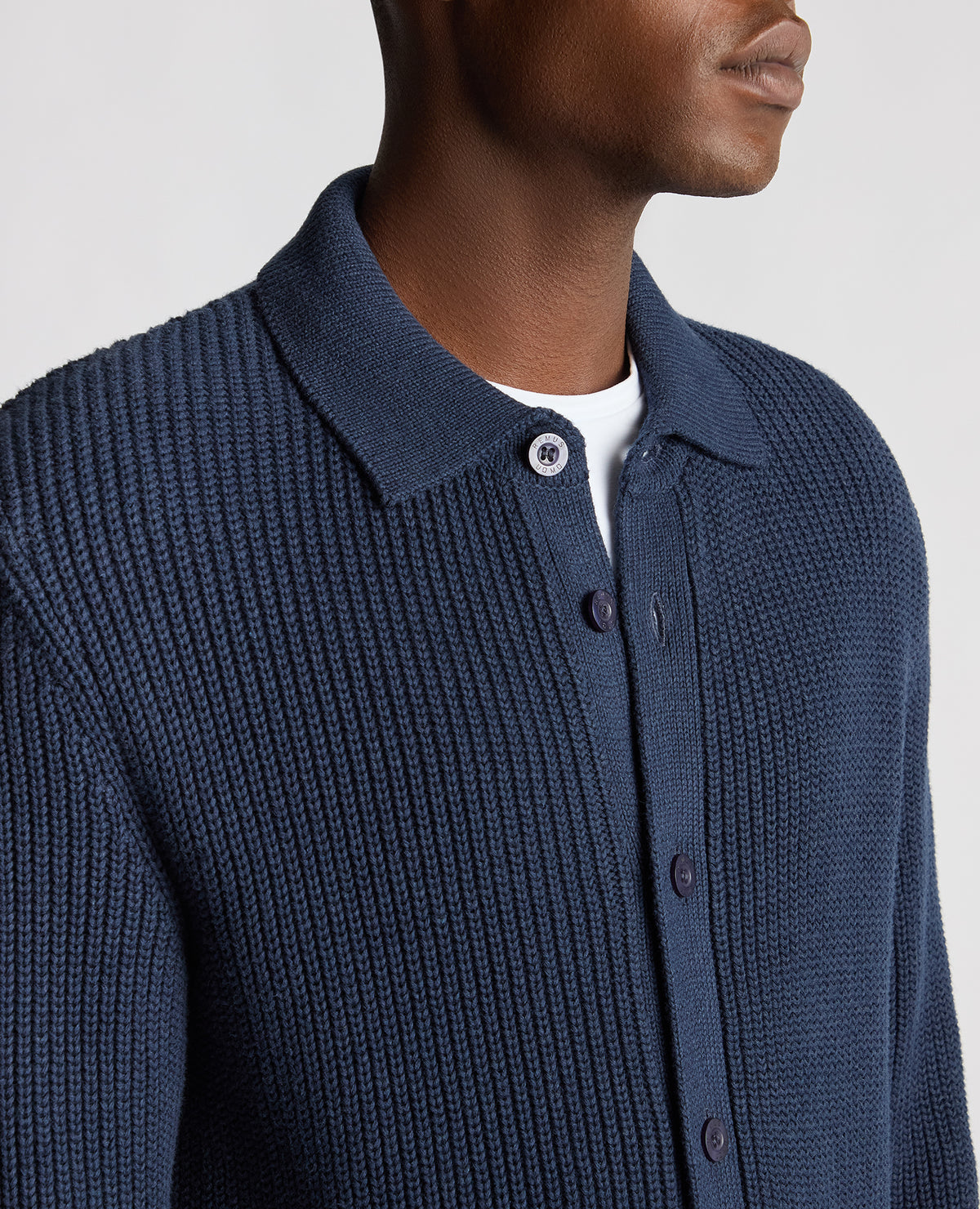 Man wearing a blue Tapered Fit Chunky Knit Cardigan