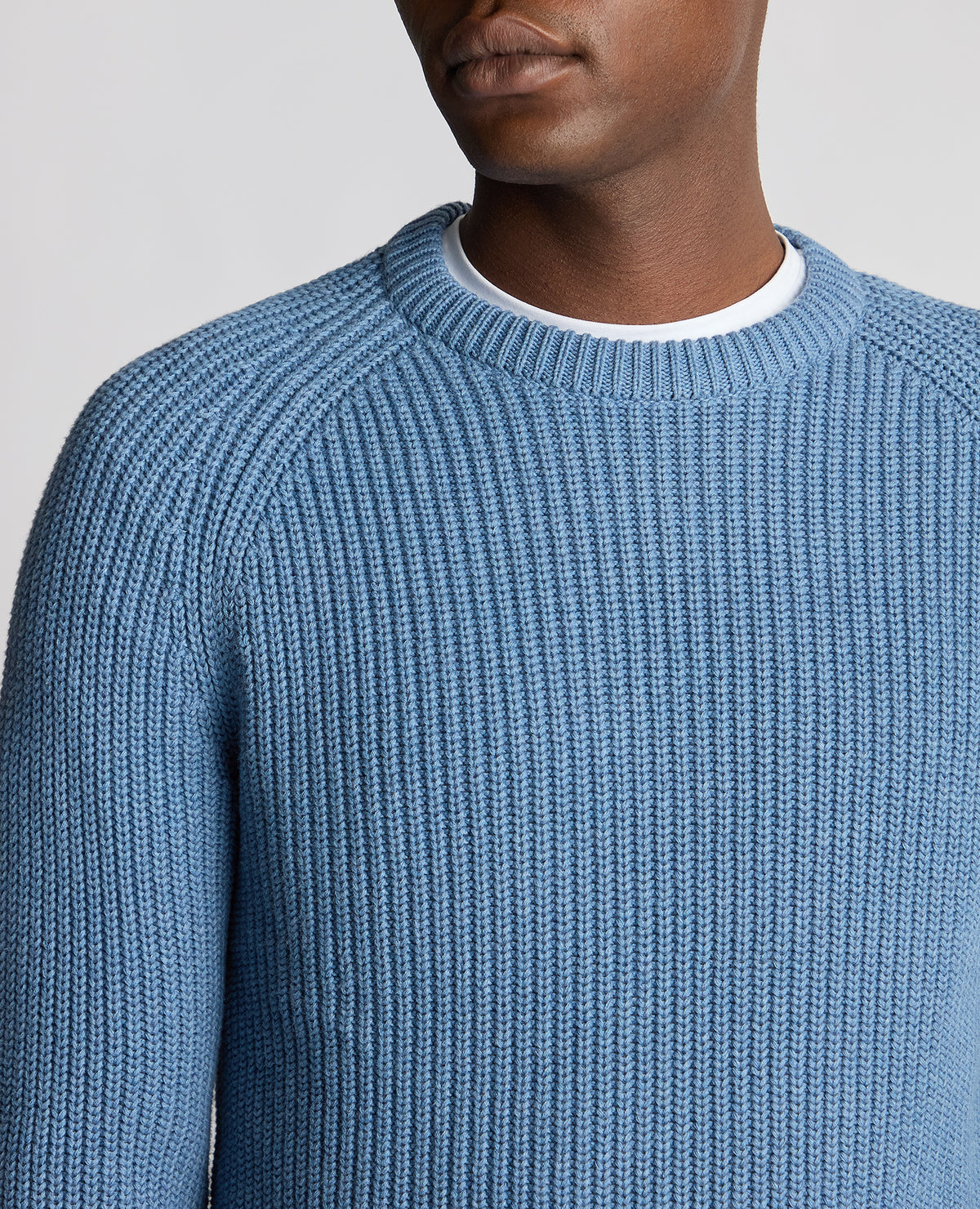 Man wearing a blue Tapered Fit Cotton Crew Neck