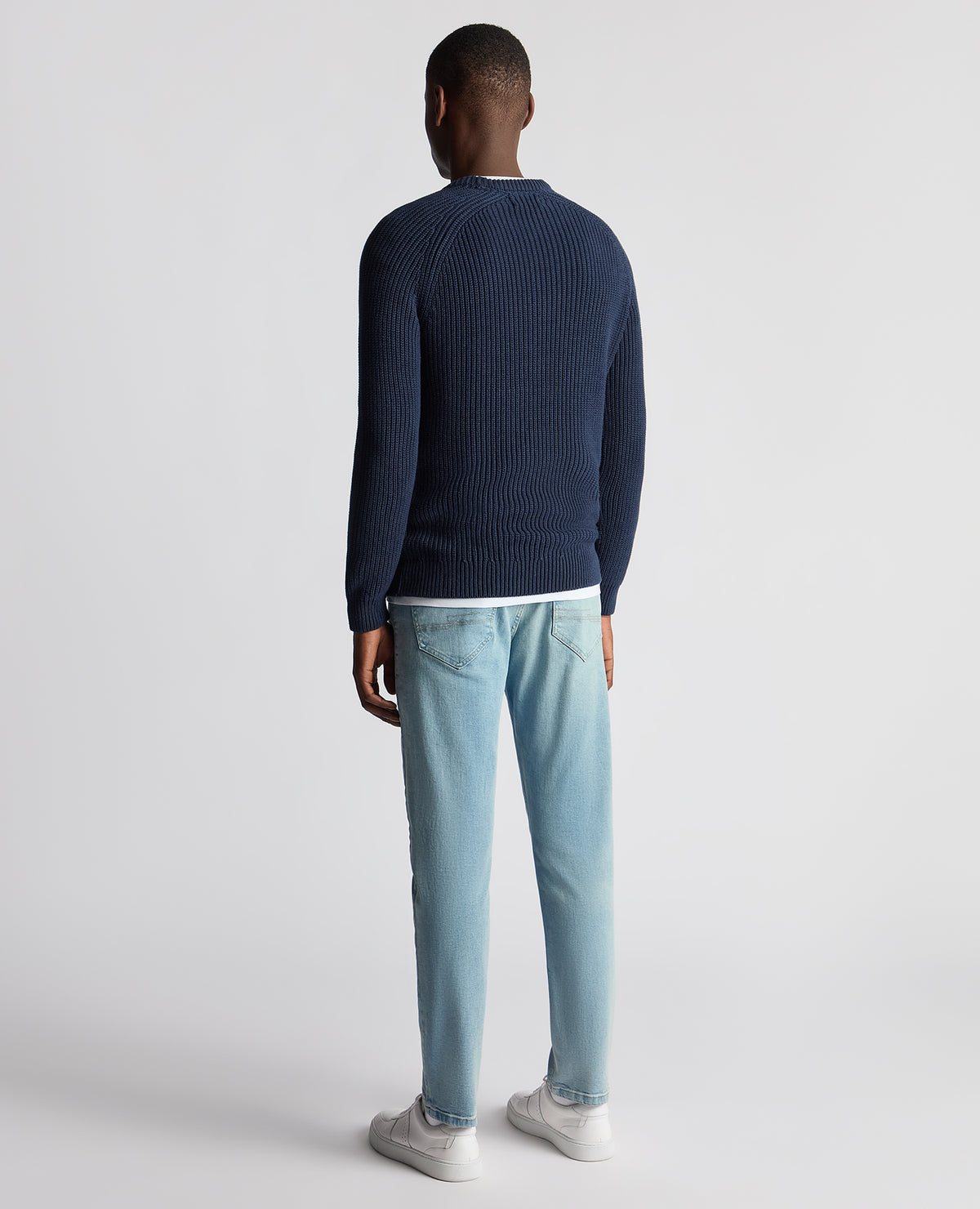 Man wearing a blue Tapered Fit Chunky Knit Sweater