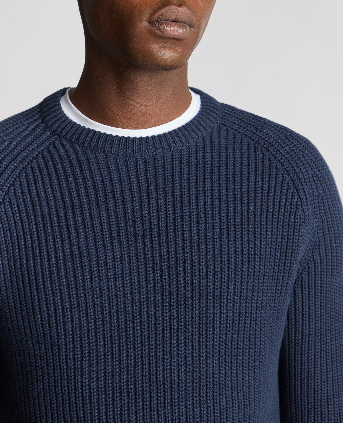 Man wearing a blue Tapered Fit Chunky Knit Sweater