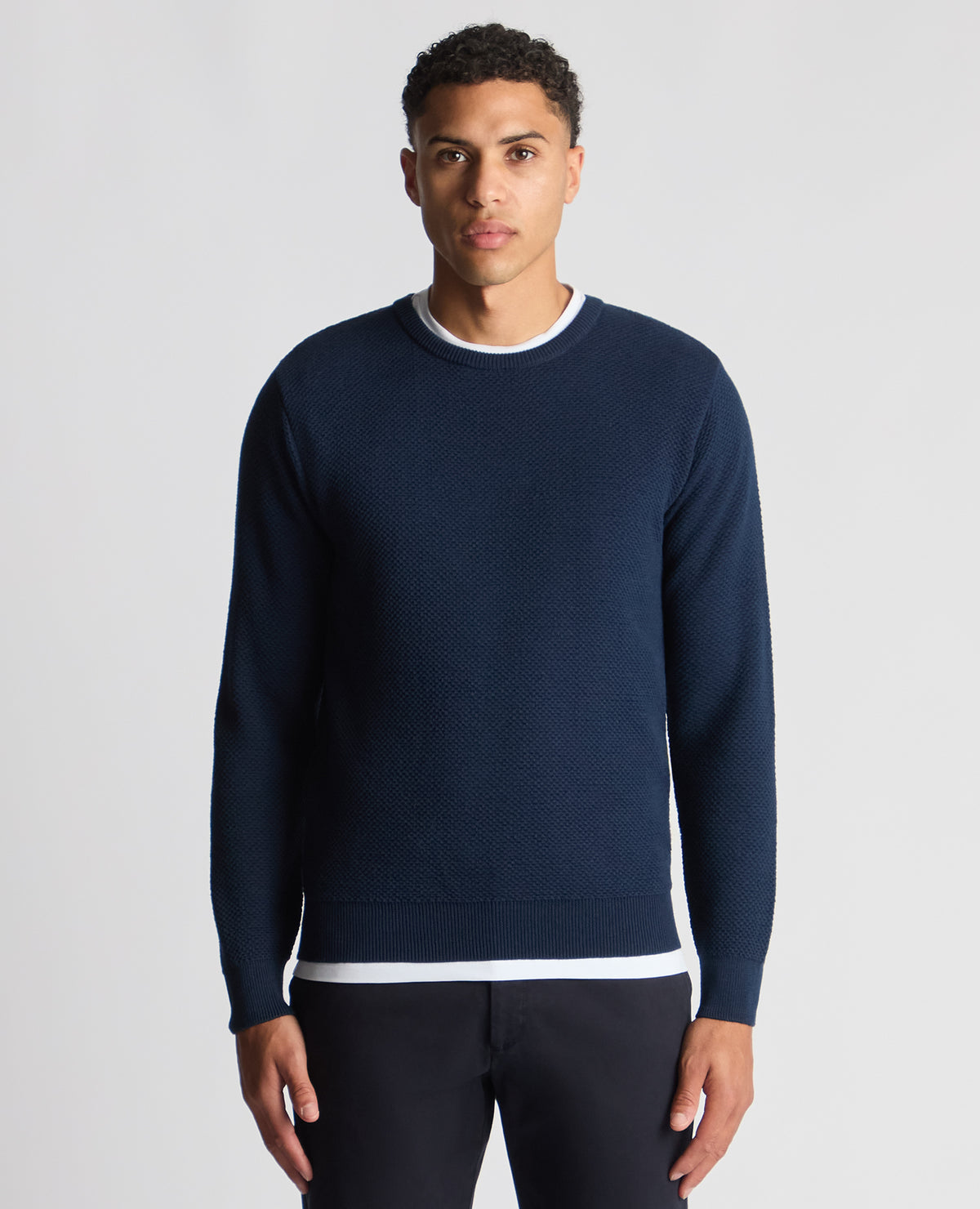 Man wearing a blue Tapered Fit Merino Wool-Blend Sweater