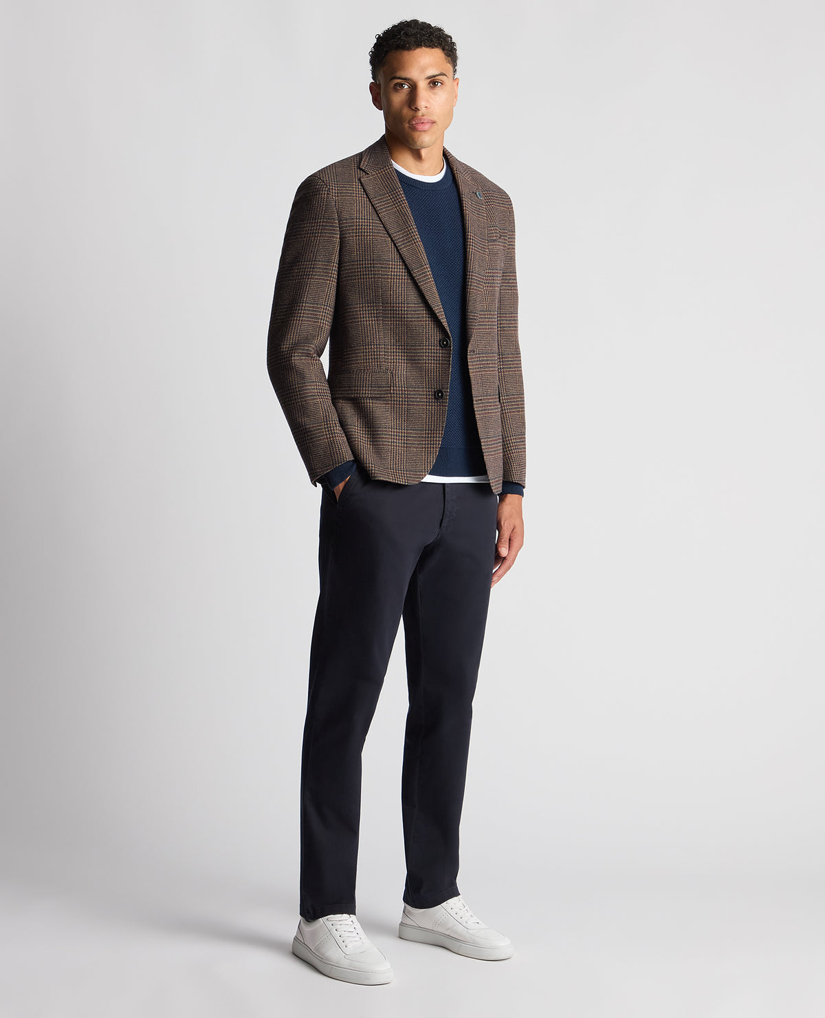 Man wearing a blue Tapered Fit Merino Wool-Blend Sweater