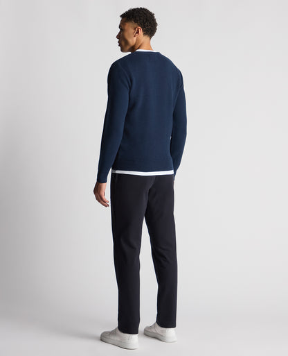 Man wearing a blue Tapered Fit Merino Wool-Blend Sweater