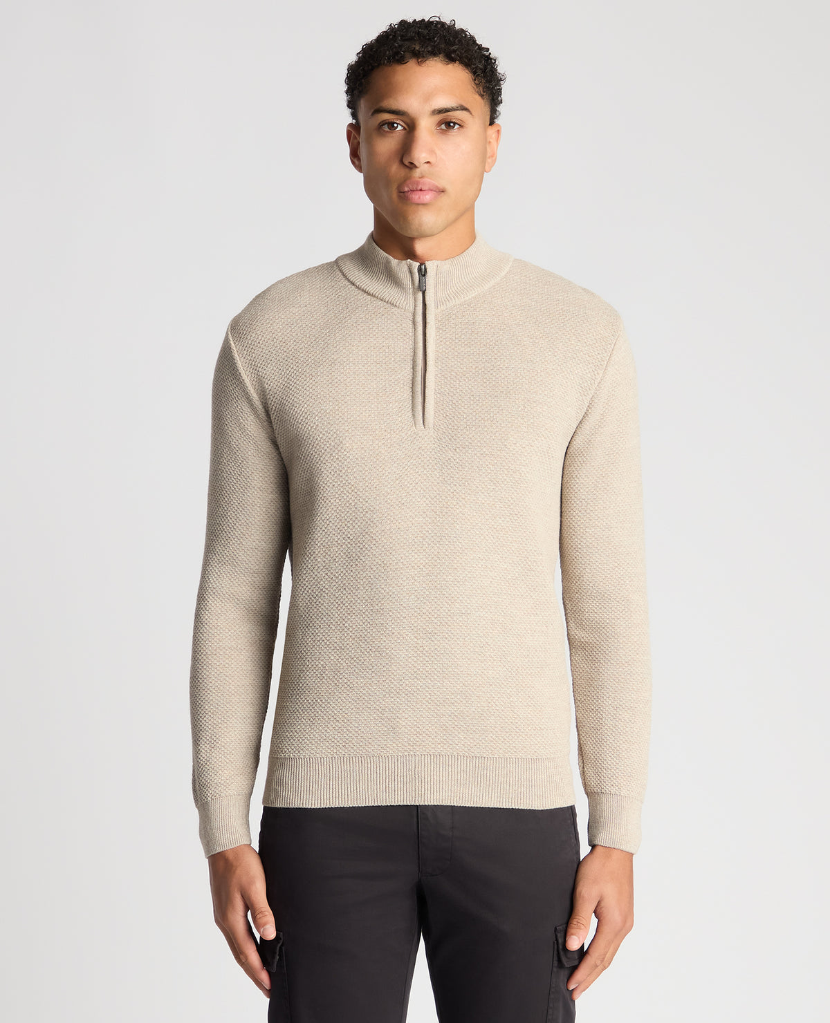 Man wearing a sand Tapered Fit Merino Half Zip Sweater