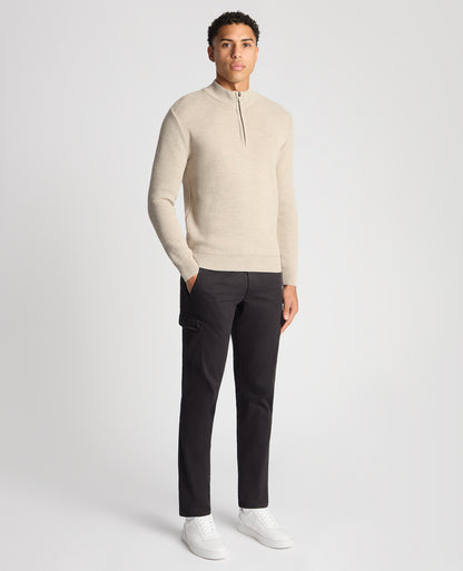 Man wearing a sand Tapered Fit Merino Half Zip Sweater