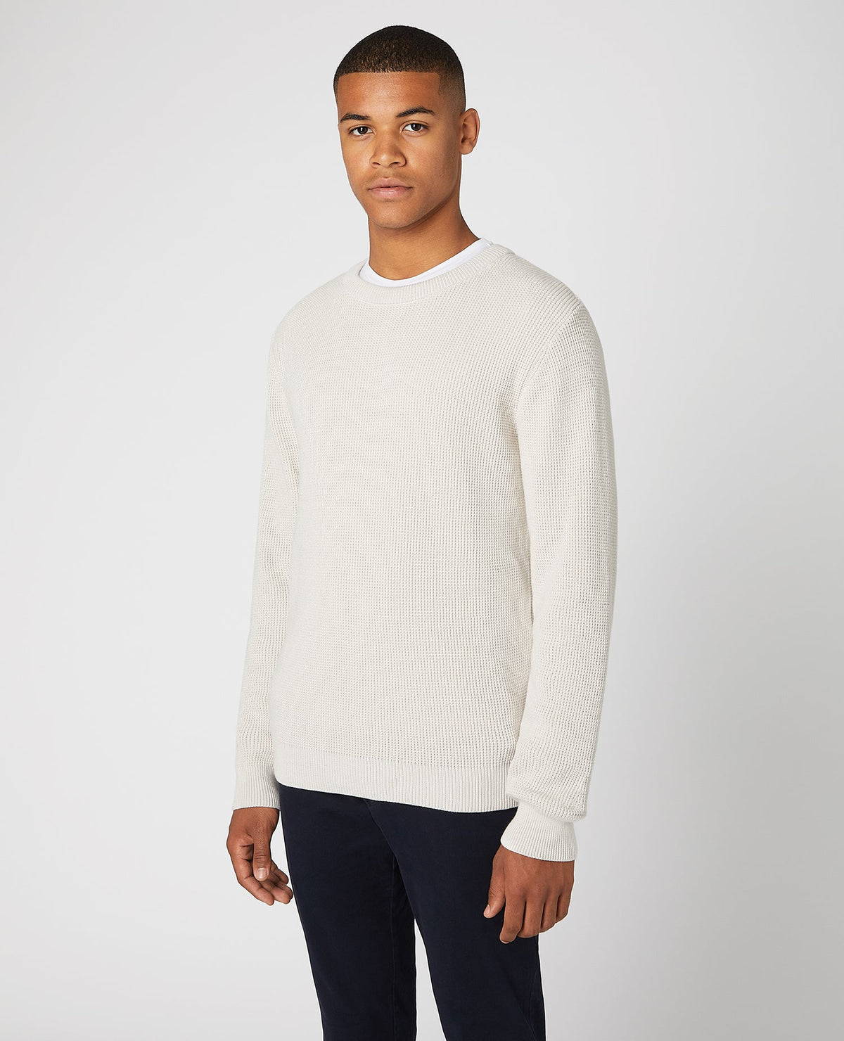 Man wearing a sand Tapered Fit Cotton-Rich Crew Neck Sweater