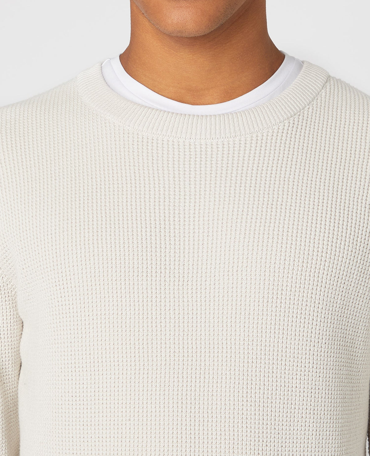 Man wearing a sand Tapered Fit Cotton-Rich Crew Neck Sweater