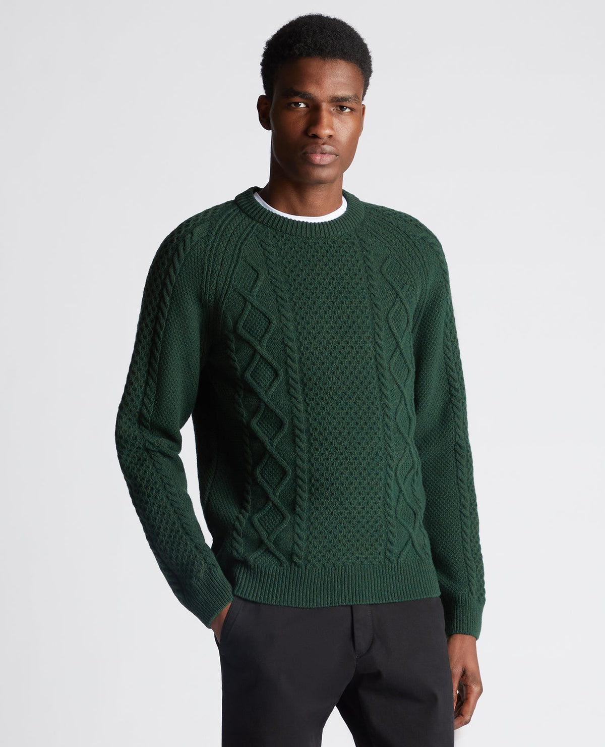 Man wearing a green Tapered Fit Wool-Blend Crew Neck Sweater