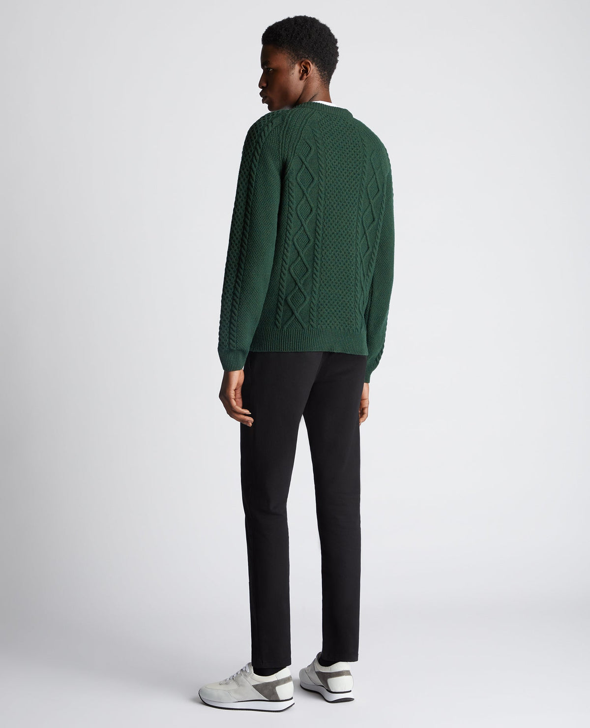 Man wearing a green Tapered Fit Wool-Blend Crew Neck Sweater