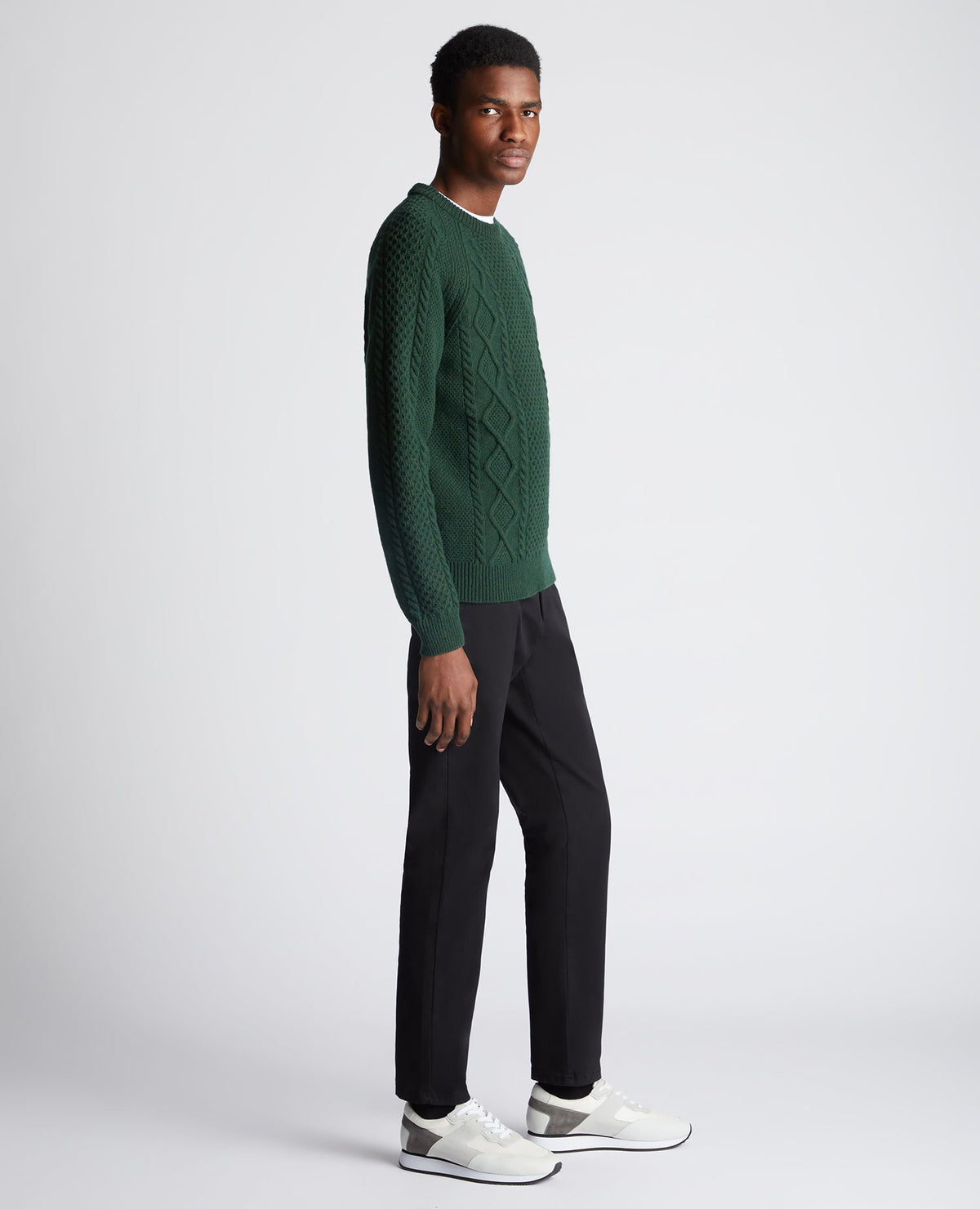 Man wearing a green Tapered Fit Wool-Blend Crew Neck Sweater